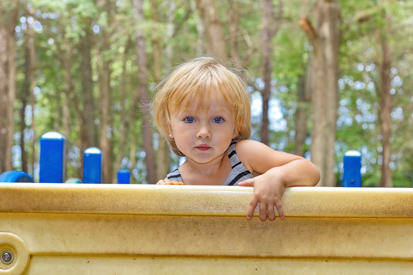 Grandduaghter climbing a wall at the park.