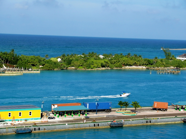 Nassau Harbour looking out from the boat over the empty second dock.  Beautiful Blues of the Caribbean Sea.