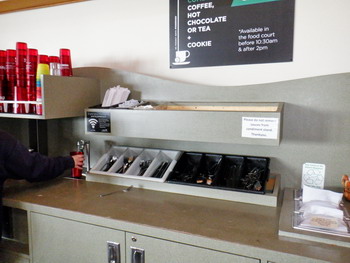 Open trays of forks, knives and spoons to be gone through by public in caffeteria with no protection from virus spreading, stacks of water glasses for all to touch, open counters to reach for condiments and utensils.