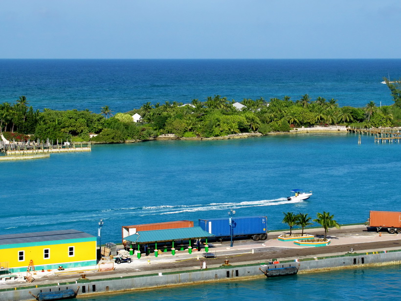 Nassau Harbour looking out from the boat over the empty second dock.  Beautiful Blues of the Caribbean Sea.
