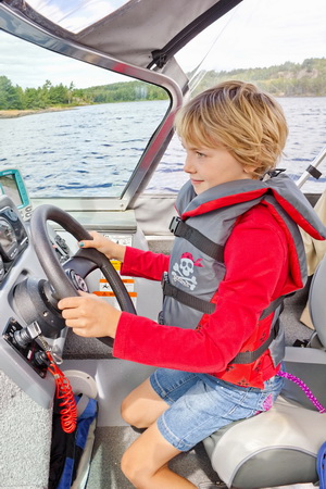 Alida gets to drive the boat.