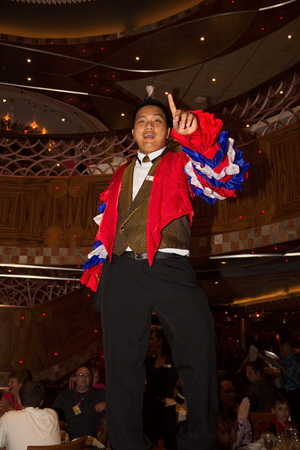 Wait staff on Carnival Legend, entertainment during dinner.
