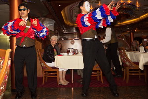 Wait Staff on Carnival Legend doing their dinner entertainment.