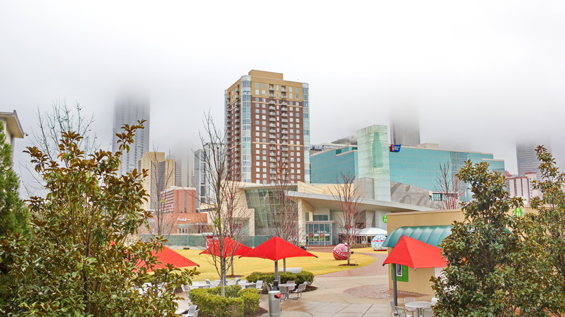 Misty Atlanta, GA, Coca Cola museum park shared with the Aquarium.
