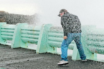 Waves crashing on to shore soak Ronnie.